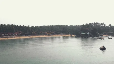 Fly over calm sea approaching Palolem Beach, Goa, South India. Stock Footage 144836812