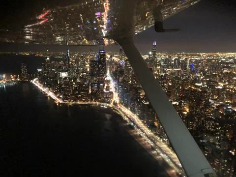 Fly Over Chicago Skyline At Night Stock Photos