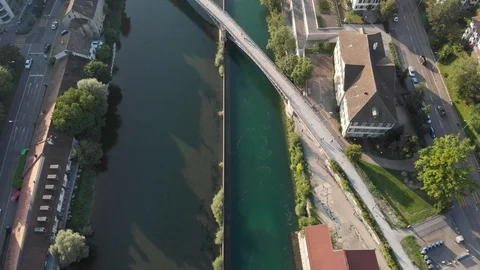 Fly over city river downstream - 4K - No color correction Stock Footage 114690630
