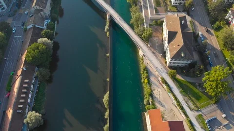 Fly over city river downstream - 4K Stock Footage 114692550