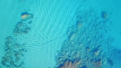 Fly over the clear blue water of the ocean. Background Stock Footage 78093852
