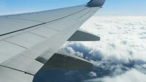 Fly over clouds formation,airliner plane wing view,travel freedom,transport 4k Stock Footage 139627947