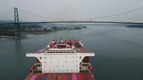 Fly over container ship towards Lions Gate bridge in Vancouver 動画素材 248478956