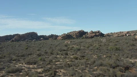 Fly Over Desert Brush Ending on Rock Formation EPIC and CINEMATIC! Stock Footage 119165026
