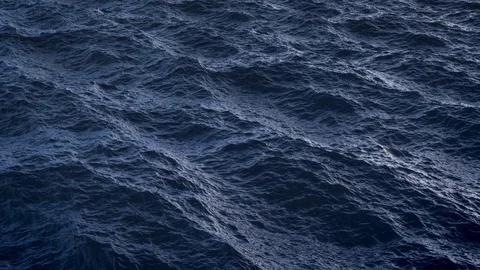 Fly over disturbed ocean water surface in slow motion Stock Footage 79921021