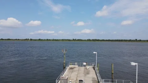 Fly-Over of a Dock on a Marshland River Coast Video stock 297040067
