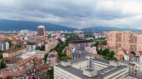 Fly over the downtown in the city of Sofia, Bulgaria, on an overcast spring Vídeos de archivo 294180910