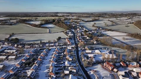 Fly over Drone shot of Snow Covered Charfield Village UK in 4K Видео 329968251