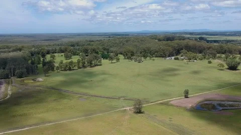 Fly Over Farm to Forest with Clouds - Drone Stock Footage 83932932