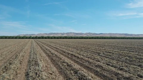 Fly Over Of Farmland To Rolling Mountains Stock Footage 89819391