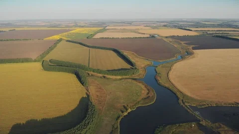 Fly over farms fields and pond Stock Footage 118160813