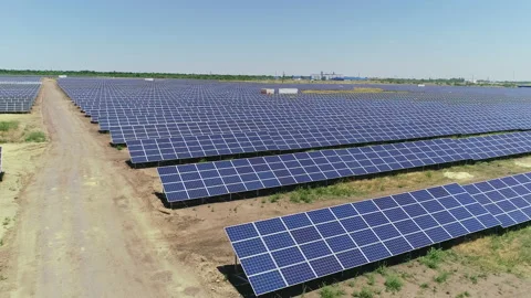 Fly over a field of solar panels in summer Stock Footage 152958150