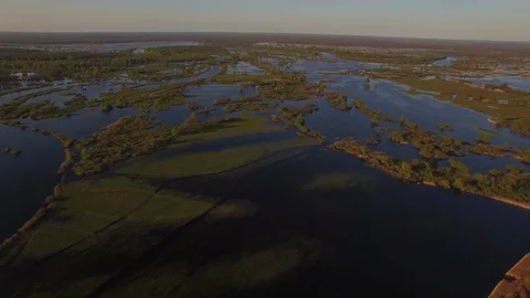 Fly over flooded river in spring with menders and trees in water aerial panorama Stock Footage 77907962
