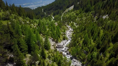 Fly over following a river down the mountain, aerial shot Stock Footage 128700789