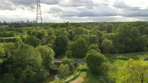 Fly over the golf course with plenty of full-grown trees in the sun, 4K Stock-Footage 155816699