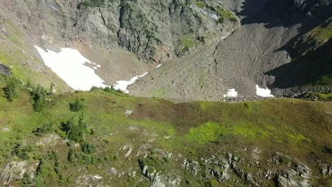 Fly over Grassy Ridge to Alpine Lake, Drone, Hiker Stock Footage 169554169