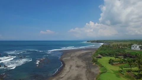 Fly over grey sand beach coastline Stock Footage 77556515