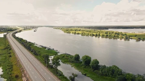 Fly over a highway to a lake Stock Footage 109604896