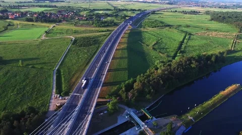 Fly over the highway in the sunset light Stock Footage 63996133