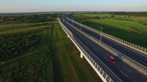 Fly over the highway in the sunset light Stock Footage 63996158