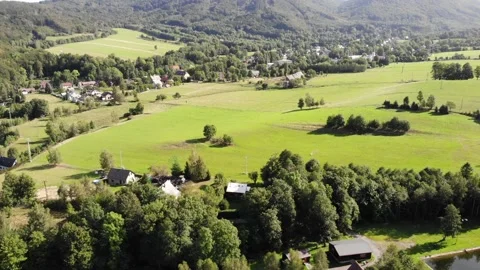 Fly-by Over a Hilly Countryside Stock Footage 152865904