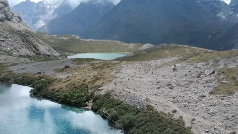 Fly over the Himalaya mountains with two very blue lakes Video stock 117989130