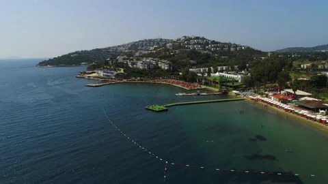 Fly over hotels in Bodrum, view from the Agaean Sea. Turkey Stock Footage 202004345