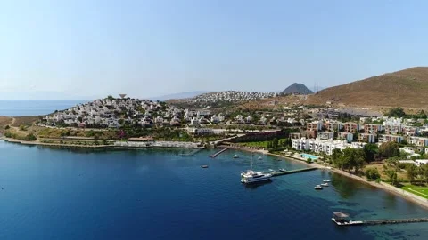 Fly over hotels in Bodrum, view from the Agaean Sea. Turkey Stock Footage 202004864