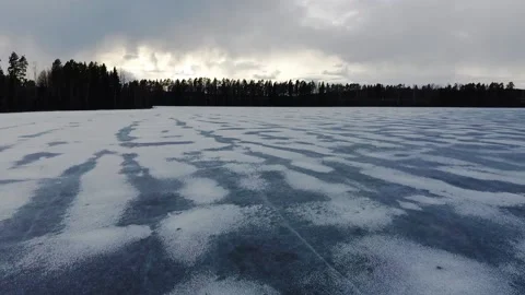 Fly over ice. Aerial view of frozen lake in Finland Stock Footage 134790630