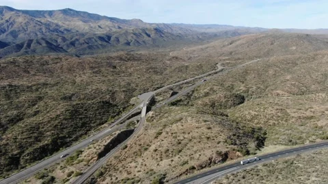 Fly over interstate between mountains Stock Footage 141774820