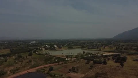 Fly over lake with mountain view drone shot in Khao Yai, thailand Stockbeeldmateriaal 148847316