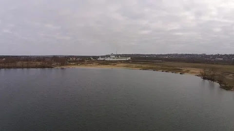 Fly over the lake with views of the monastery Stock Footage 45980250