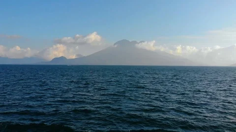 Fly Over Lake to Volcano Stock Footage 122839666