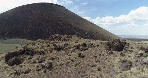 Fly over lava rubble to SP Crater in Northern Arizona Stock Footage 202978688