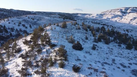 Fly over light snow covered Montana landscape Stock Footage 310574744