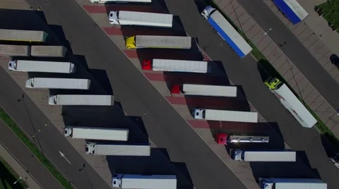 Fly over lorry trucks rows at parking place spot lot aerial top view above 4K Stock Footage 66976511
