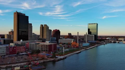 Fly-over of Maumee River with view of downtown Toledo, Ohio, daytime Stock Footage 257129267