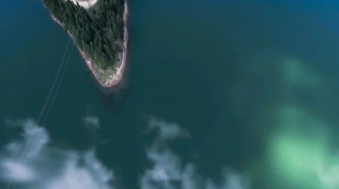 Fly Over Mirror Mountain Lake Surrounded By Forest Stock Footage 66418210