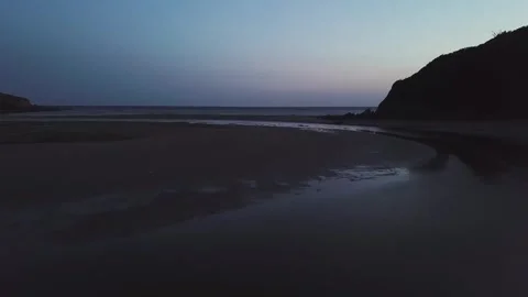 Fly over Mothecoombe beach after sunset 4k Stock Footage 320946435