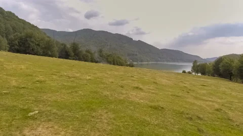 Fly Over Mountain Lake Surrounded By Forest Stock Footage 67604038