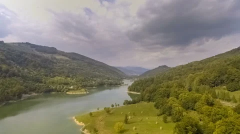 Fly Over Mountain Lake Surrounded By Forest Stock Footage 67604209