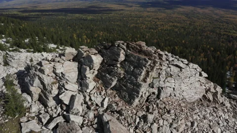 Fly over the mountain peak overlooking the lake Video stock 147036144