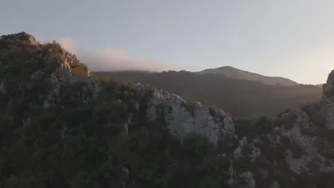 Fly Over Mountain Peak Revealing Misty Ridge Sunset 4K 60fps Stock Footage 337412403