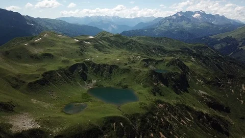 Fly Over Mountain Range And Emerald Glacial Lake Stock-Footage 126753386