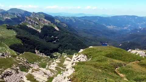 Fly over mountain ridge and climb to altitude Stock Footage 134007691