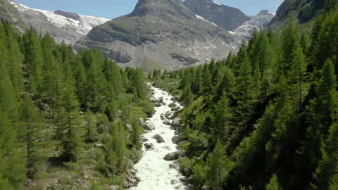 Fly over mountain river to the glacier in Swiss alps - Valais 4k Video stock 156051834
