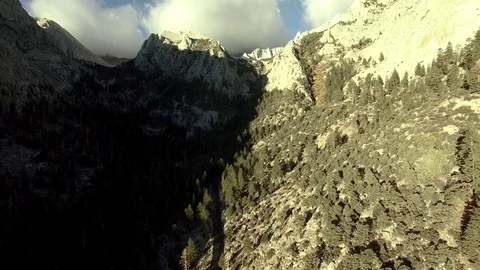 Fly over mountain valleys with trees at Mt Whitney Stock Footage 71215795