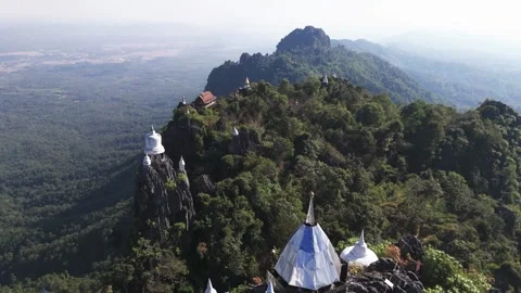 Fly over mountaintops at Wat Phra Phutthabat Sutthawat in north Thailand (1of2) Stock-Footage 330967366
