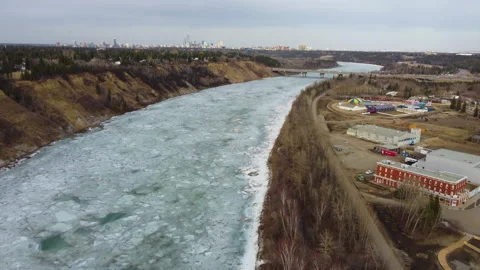 Fly over North Saskatchewan River with downtown Edmonton in Background Stock Footage 151882857