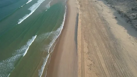 Fly over ocean beach - drone footage Stock Footage 294701261